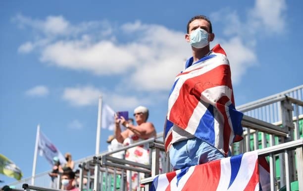 Man with a Great Britain flag looks on as Johanna Konta of Great Britain plays Nina Stojanovic of Serbia during theViking Open women's semi-finals...