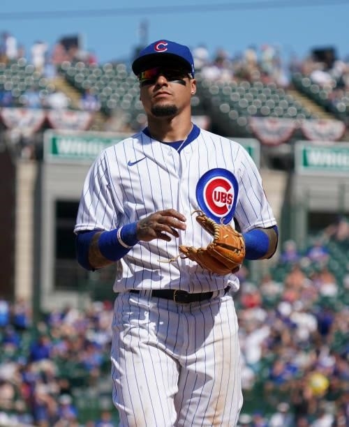 Javier Baez of the Chicago Cubs trots to the dugout during the sixth inning of a game against the St. Louis Cardinals at Wrigley Field on June 11,...