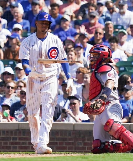Sergio Alcántara of the Chicago Cubs flips his bat after a strike ball during the seventh inning of a game against the St. Louis Cardinals at Wrigley...