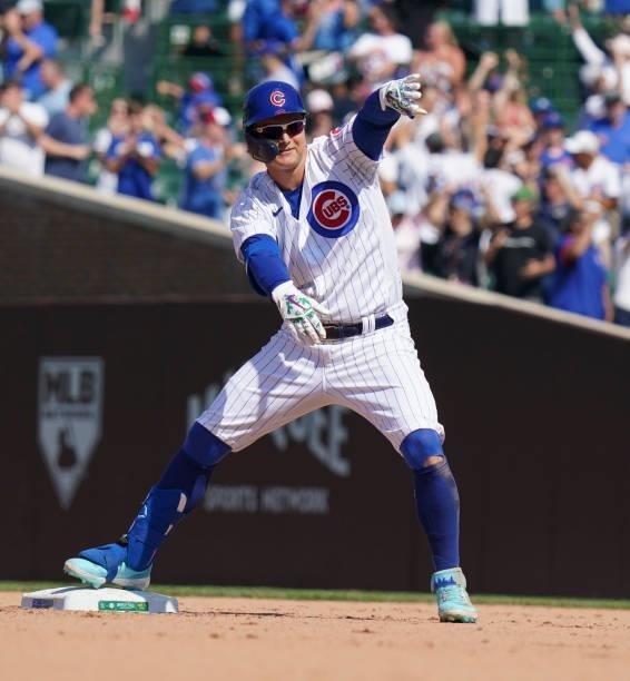 Joc Pederson of the Chicago Cubs reacts after his two-run double during the seventh inning of a game against the St. Louis Cardinals at Wrigley Field...