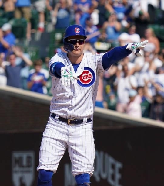 Joc Pederson of the Chicago Cubs reacts after his two-run double during the seventh inning of a game against the St. Louis Cardinals at Wrigley Field...