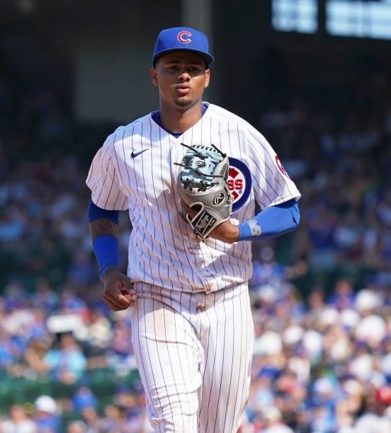 Sergio Alcántara of the Chicago Cubs runs to the dugout during the eighth inning of a game against the St. Louis Cardinals at Wrigley Field on June...