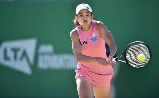 Shuai Zhang of China plays a backhand shot to Lauren Davis of United during the women's semi-finals match on day eight of the Viking Open at...