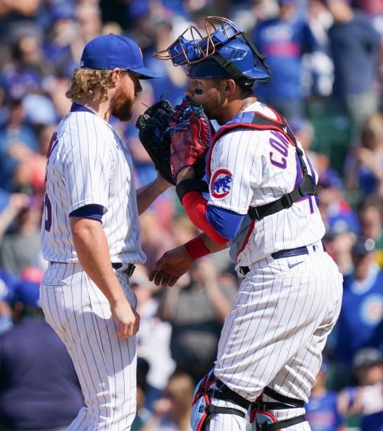 Craig Kimbrel of the Chicago Cubs speaks with Willson Contreras during the ninth inning of a game against the St. Louis Cardinals at Wrigley Field on...