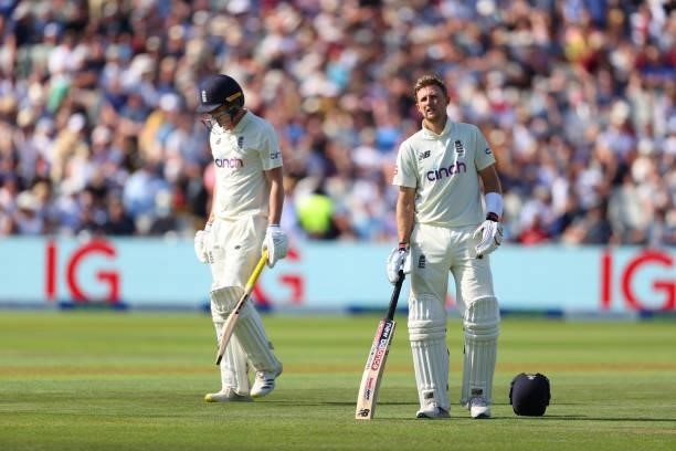 England batsman Dan Lawrence walks off after being dismissed for 0 as captain Joe Root looks on during day three of the second LV= Insurance Test...