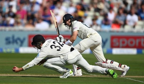 England batsman Joe Root has a shot stopped by short leg fielder Will Young during day three of the second LV= Insurance Test Match between England...