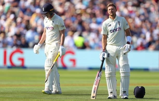 England batsman Dan Lawrence walks off after being dismissed for 0 as captain Joe Root looks on during day three of the second LV= Insurance Test...