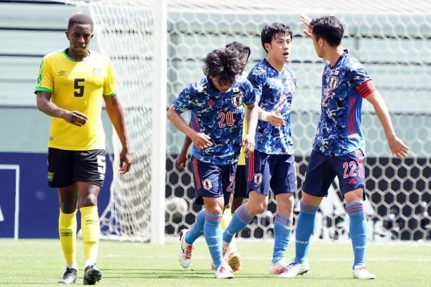 Wataru Endo of Japan U-24 celebrates scoring his side's second goal with team mate during the U-24 international friendly match between Japan and...