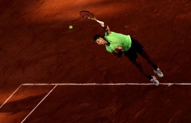 Rafael Nadal of Spain serves during his Men's Singles Semi Final match against Novak Djokovic of Serbia on day Thirteen of the 2021 French Open at...