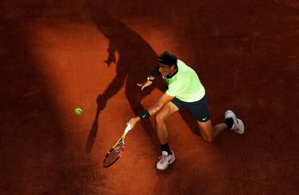 Rafael Nadal of Spain plays a forehand volley during his Men's Singles Semi Final match against Novak Djokovic of Serbia on day Thirteen of the 2021...
