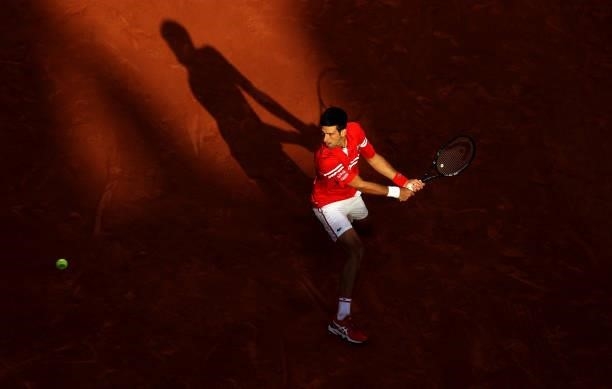 Novak Djokovic of Serbia plays a backhand during his Men's Singles Semi Final match against Rafael Nadal of Spain on day Thirteen of the 2021 French...
