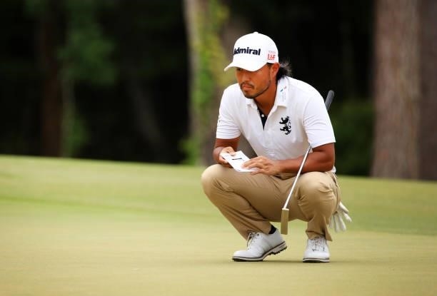 Satoshi Kodaira of Japan lines up a putt on the 11th green during the third round of the Palmetto Championship at Congaree on June 12, 2021 in...