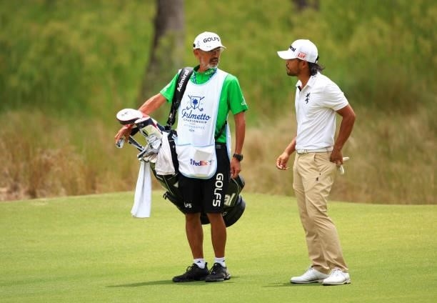 Satoshi Kodaira of Japan prepares to play his shot on the 11th hole during the third round of the Palmetto Championship at Congaree on June 12, 2021...