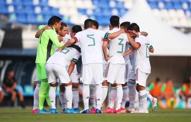 Players of Mexico huddle prior to a International Friendly match between Mexico and Australia at Marbella Municipal Stadium on June 12, 2021 in...