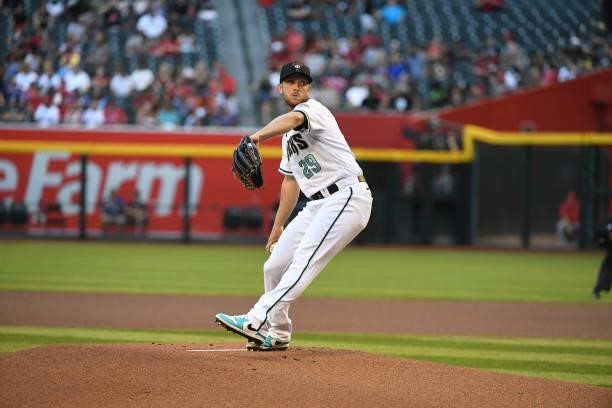 Merrill Kelly of the Arizona Diamondbacks delivers a pitch against the Los Angeles Angels at Chase Field on June 11, 2021 in Phoenix, Arizona.