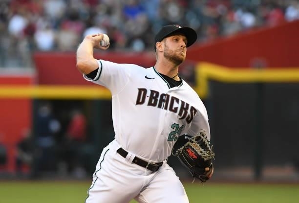 Merrill Kelly of the Arizona Diamondbacks delivers a pitch against the Los Angeles Angels at Chase Field on June 11, 2021 in Phoenix, Arizona.