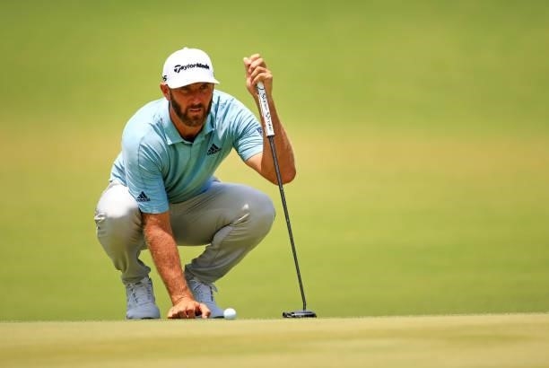 Dustin Johnson lines up a putt on the first green during the third round of the Palmetto Championship at Congaree on June 12, 2021 in Ridgeland,...
