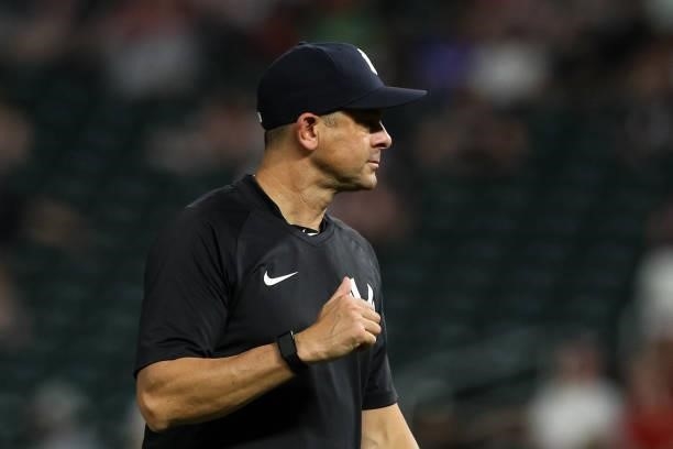 Aaron Boone of the New York Yankees walks back to the dugout in the fifth inning of the game against the Minnesota Twins at Target Field on June 10,...