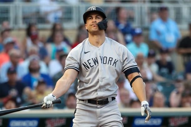 Giancarlo Stanton of the New York Yankees reacts after striking out against the Minnesota Twins in the third inning of the game at Target Field on...