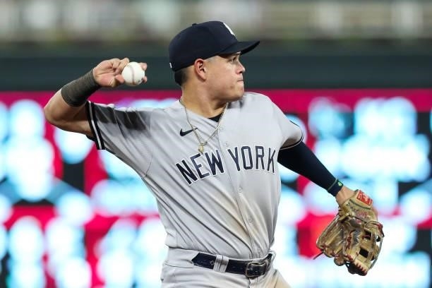 Gio Urshela of the New York Yankees throws the ball to first base to get out Trevor Larnach of the Minnesota Twins in the seventh inning of the game...