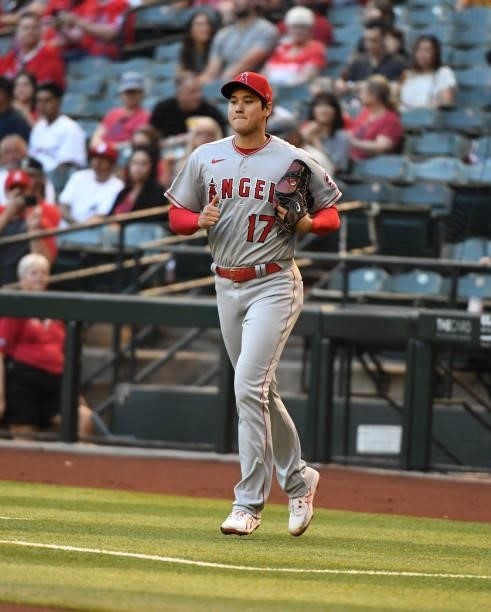Shohei Ohtani of the Los Angeles Angels runs to the pitchers mound against the Arizona Diamondbacks during the first inning at Chase Field on June...