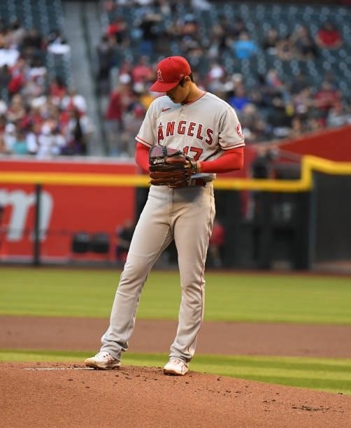 Shohei Ohtani of the Los Angeles Angels prepares to deliver a first inning pitch against the Arizona Diamondbacks at Chase Field on June 11, 2021 in...