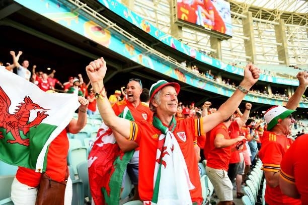 Supporters of Wales celebrate a goal during the UEFA Euro 2020 Championship Group A match between Wales and Switzerland on June 12, 2021 in Baku,...