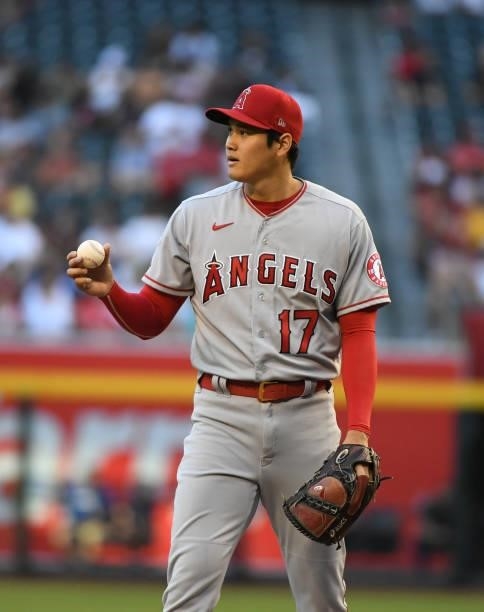 Shohei Ohtani of the Los Angeles Angels prepares to deliver a first inning pitch against the Arizona Diamondbacks at Chase Field on June 11, 2021 in...