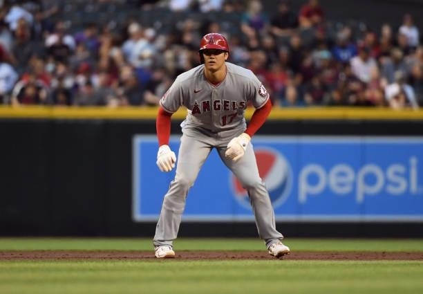Shohei Ohtani of the Los Angeles Angels takes a lead from second base against the Arizona Diamondbacks at Chase Field on June 11, 2021 in Phoenix,...