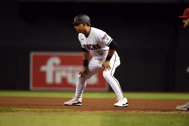 Eduardo Escobar of the Arizona Diamondbacks takes a lead from first base against the Los Angeles Angels at Chase Field on June 11, 2021 in Phoenix,...