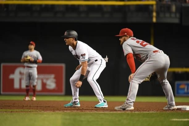 Josh Rojas of the Arizona Diamondbacks takes a lead from first base against the Los Angeles Angels at Chase Field on June 11, 2021 in Phoenix,...