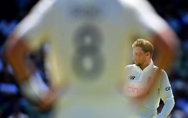 Joe Root of England prepares to bowl from behind Stuart Broad of England during day three of the second LV= Insurance Test Match between England and...