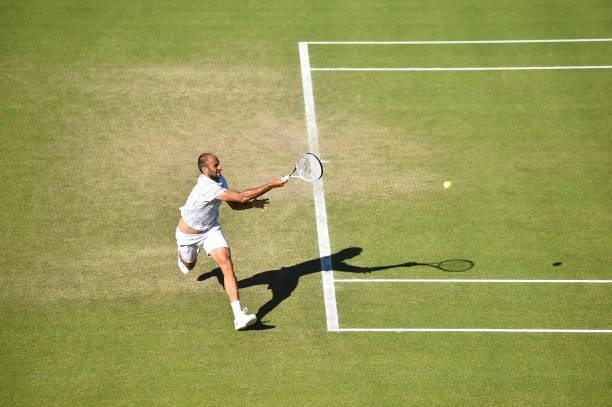 Marius Copil of Romania plays a forekhand shot against Frances Tiafore of United States during the men's semi-finals match on day eight of the Viking...