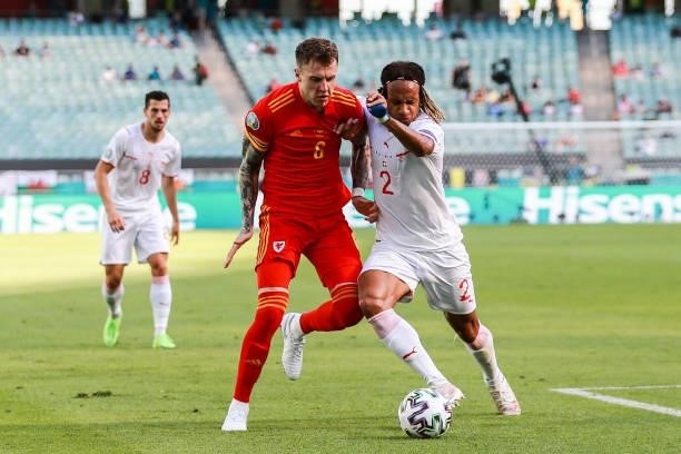 Joe Rodon of Wales in action against Kevin Mbabu of Switzerland during the UEFA Euro 2020 Championship Group A match between Wales and Switzerland at...
