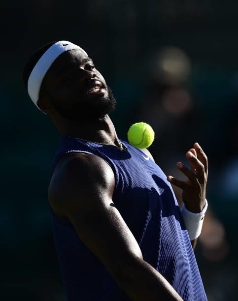 Frances Tiafore of United States catches a ball as he plays against Marius Copil of Romania during the men's semi-finals match on day eight of the...