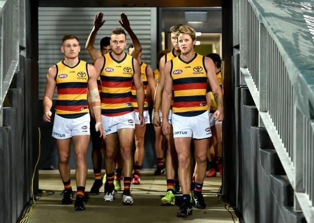 Adelaide Crows take to the field during the round 13 AFL match between the St Kilda Saints and the Adelaide Crows at Cazaly's Stadium on June 12,...