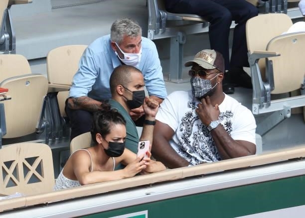 Tony Parker, his girlfriend Alize Lim , Teddy Riner, above them President of French Tennis Federation FFT Gilles Moretton attend day 13 of the 2021...