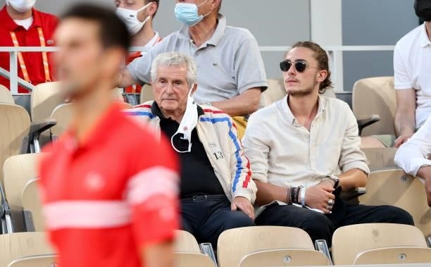 Claude Lelouch and grand-son Boaz Lelouch watching Novak Djokovic of Serbia during day 13 of the 2021 Roland-Garros, French Open, a Grand Slam tennis...