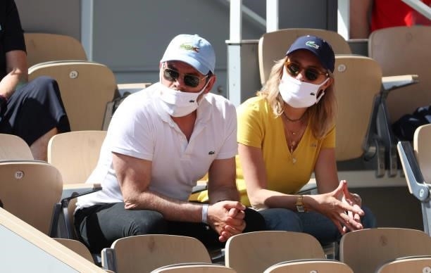 Clovis Cornillac and his wife Lilou Fogli attend day 13 of the 2021 Roland-Garros, French Open, a Grand Slam tennis tournament at Roland-Garros...