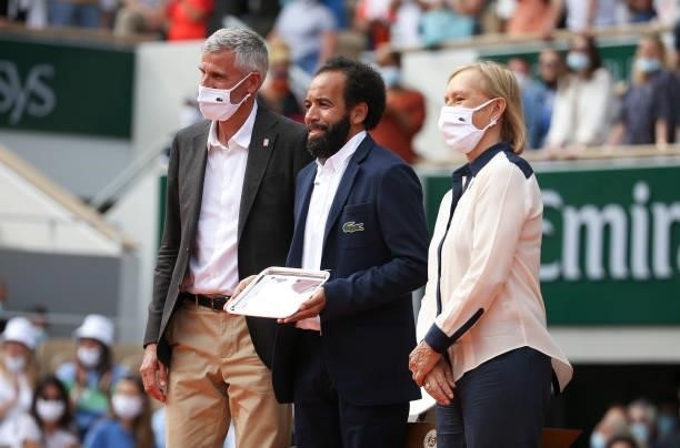 President of French Tennis Federation FFT Gilles Moretton, French chair umpire Kader Nouri, trophy presenter Martina Navratilova during the trophy...