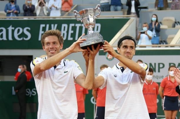 Winners Nicolas Mahut and Pierre-Hughes Herbert of France during the Men's Doubles final trophy ceremony on day 14 of the French Open 2021,...