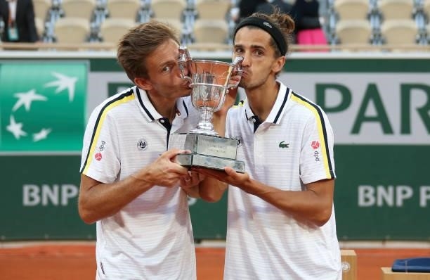 Winners Nicolas Mahut and Pierre-Hughes Herbert of France during the Men's Doubles final trophy ceremony on day 14 of the French Open 2021,...