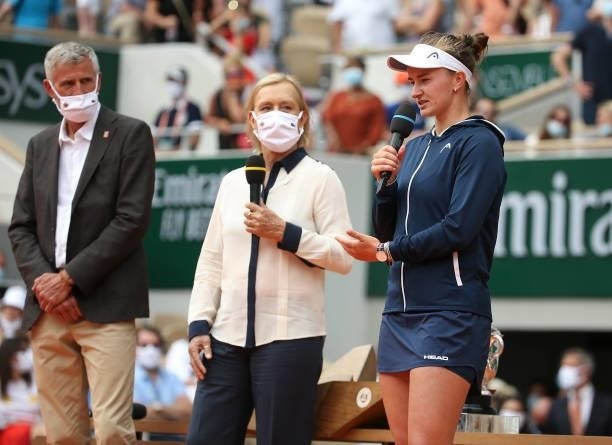 From left, President of French Tennis Federation FFT Gilles Moretton, trophy presenter Martina Navratilova, winner Barbora Krejcikova of Czech...
