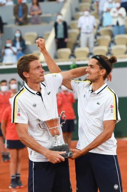 Winners Nicolas Mahut and Pierre-Hughes Herbert of France during the Men's Doubles final trophy ceremony on day 14 of the French Open 2021, Grand...