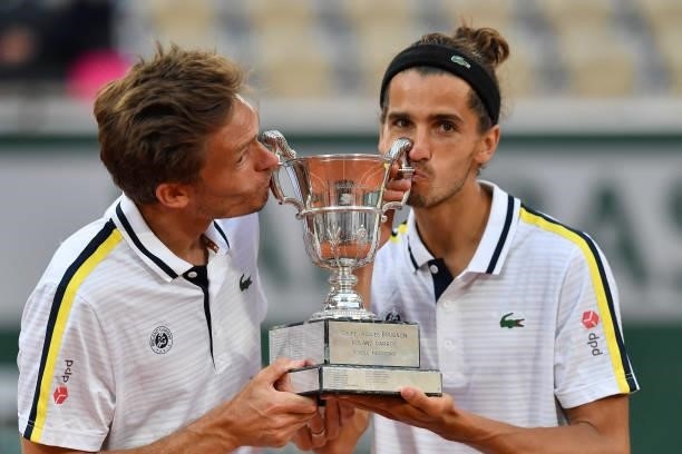 Winners Nicolas Mahut and Pierre-Hughes Herbert of France during the Men's Doubles final trophy ceremony on day 14 of the French Open 2021, Grand...