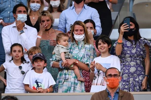 Pierre-Hughes Herbert's companion Julia Lang and their kid during the Men's Doubles final trophy ceremony on day 14 of the French Open 2021, Grand...