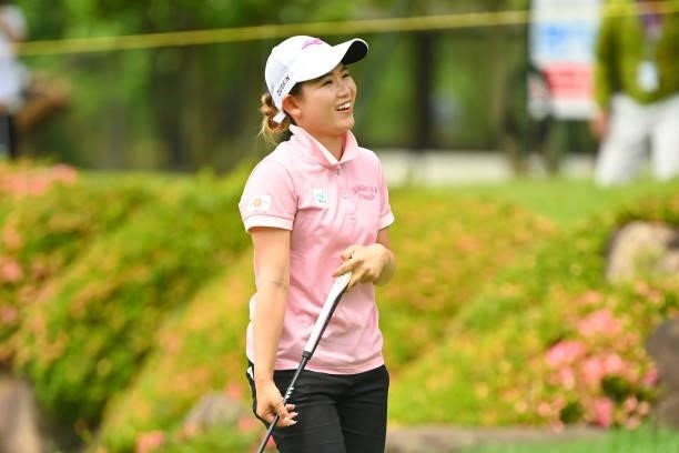 Hikaru Yoshimoto of Japan smiles as she holes out with the birdie on the 18th green during the final round of the Ai Miyazato Suntory Ladies Open at...