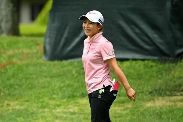 Hikaru Yoshimoto of Japan smiles as she holes out with the birdie on the 18th green during the final round of the Ai Miyazato Suntory Ladies Open at...