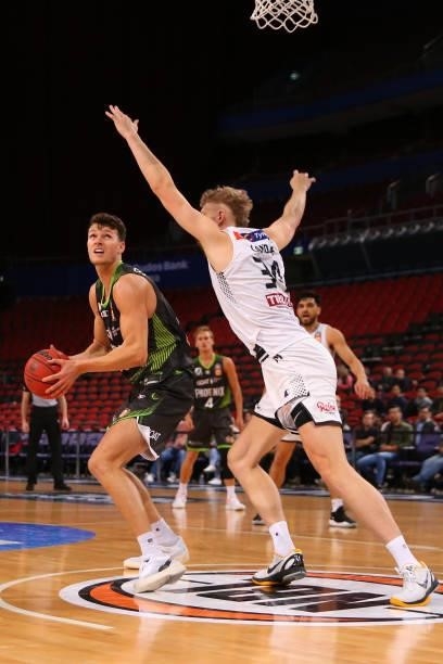 Yanni Wetzall of the Phoenix drives to the basket under pressure Jock Landale of United during game two of the NBL Semi-Final Series between the...