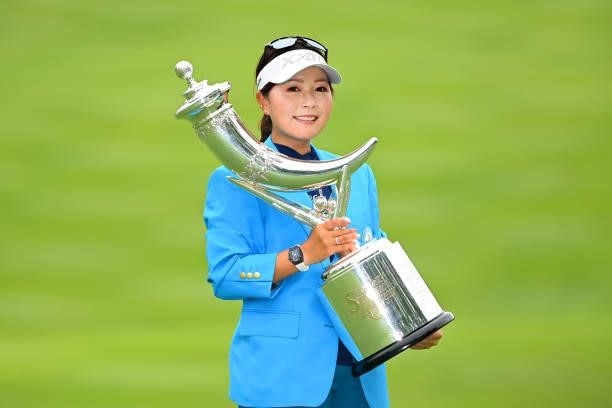 Serena Aoki of Japan poses with the trophy after winning the tournament following the final round of the Ai Miyazato Suntory Ladies Open at Rokko...